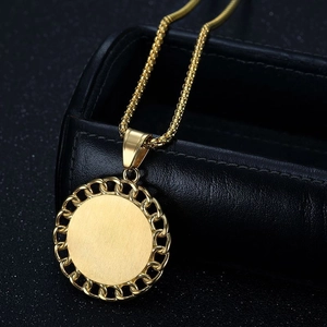 Gold round pendant necklace with woven edge on black leather jewelry box, hip hop style
