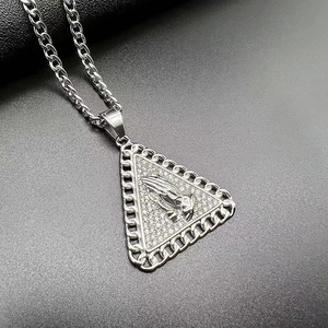 Detailed macro view of the silver-plated prayer hands triangular pendant with cubic zirconia