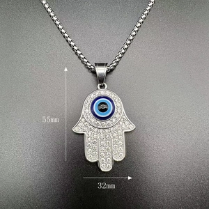 Detailed view of silver Hamsa Hand pendant with Evil Eye and rhinestones, 55mm x 32mm