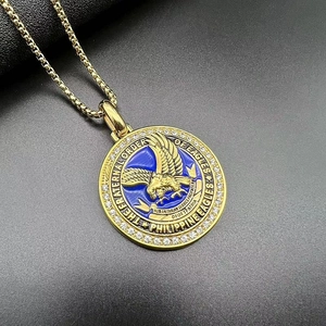 Detailed close-up of Philippine Eagles blue enamel pendant with gold eagle and cubic zirconia