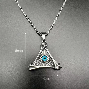 Macro detail of gothic triangle evil eye pendant with 50mm by 40mm size dimensions
