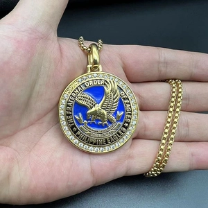 Macro detail of Fraternal Order of Eagles medallion with blue enamel and eagle motif
