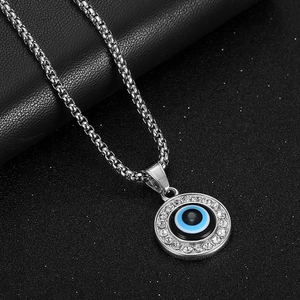 Silver stainless steel box chain necklace featuring a crystal-encrusted evil eye pendant