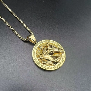 Detailed close-up of a gold-plated horse head pendant with Greek fret pattern and box chain