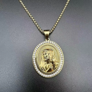 Macro shot of gold hip hop religious pendant featuring Jesus relief and sparkling zircons