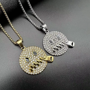 Detail of hip hop smile face pendant with zipper mouth design and inlaid rhinestones