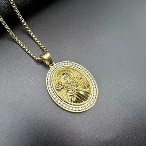 Gold St. Benedict religious pendant with cubic zirconia on a box chain for men