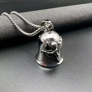 Detailed close-up of a silver titanium steel punk bell pendant with cupid embossed relief