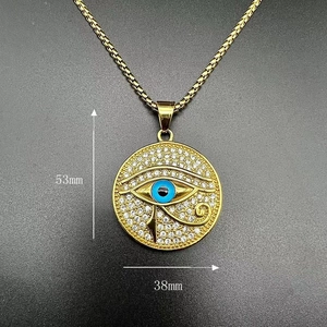 Detail view of gold-plated Eye of Horus pendant with white rhinestones, size 38mm x 53mm