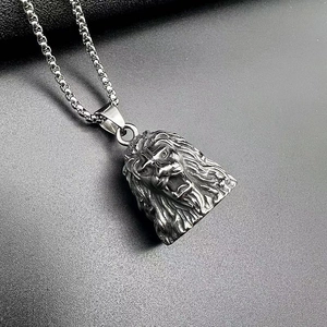 Macro detail of retro stainless steel lion head pendant with intricate metallic texture