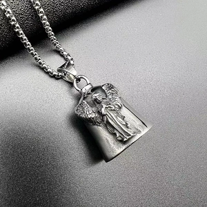 Detailed view of silver titanium steel angel wings bell pendant with vintage punk finish