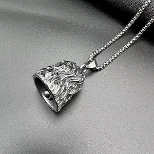 Detailed view of punk style stainless steel bell pendant with relief wave textures