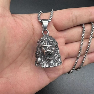 Macro shot of punk style stainless steel lion head pendant with intricate mane textures