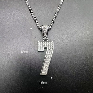 Macro shot of silver number 7 pendant with cubic zirconia and box chain measurements