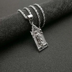 Macro view of religious pendant featuring Virgin Mary relief on gothic steel frame