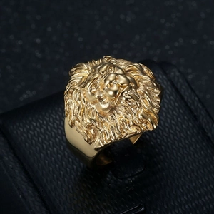 Golden hip hop lion head ring made of vacuum plated titanium steel on a black jewelry box