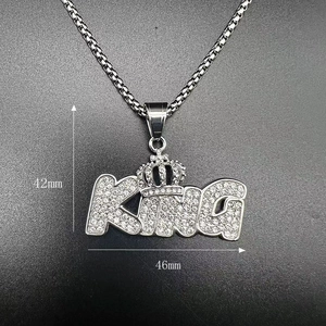 Detailed view of iced out KING letter pendant with crown showing 42mm by 46mm dimensions