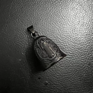 Polished black titanium steel St. Benedict exorcism rider bell pendant on leather