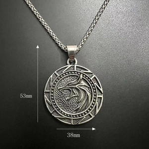 Macro view of Viking wolf head pendant showing detailed engraving and 53mm by 38mm dimensions