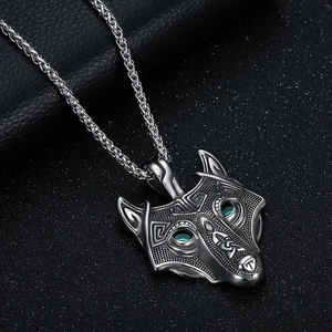 Viking wolf head necklace in stainless steel with green eyes and Celtic patterns