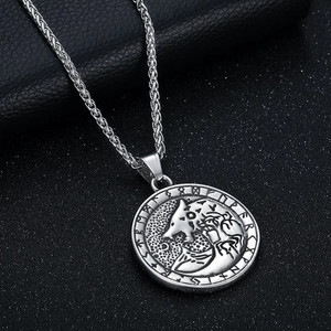Silver Viking wolf head pendant necklace with Runic alphabet on a black background