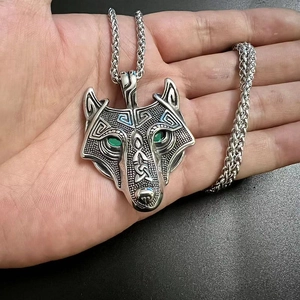 Nordic Viking stainless steel wolf head pendant with green eyes on a chunky chain