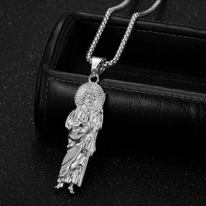 Close-up of Saint Jude relief pendant with halo details on silver snake chain