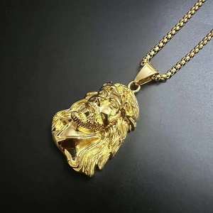 Macro detail of gold plated 3D Jesus portrait pendant with intricate thorn crown texture