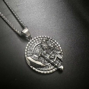 Macro view of vintage silver Viking raven pendant with Norse runes and wheat chain detail