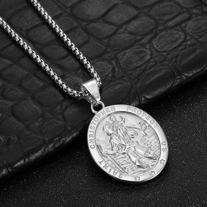 Detailed macro of Saint Christopher pendant necklace with embossed engraving on box chain