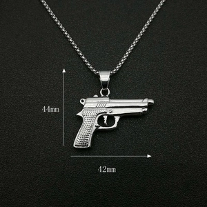 Detailed view of silver pistol pendant necklace showing precise 44mm by 42mm dimensions