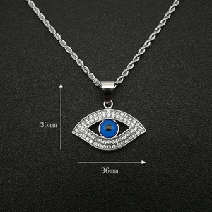 Collier avec pendentif Mauvais Œil plaqué or, cristaux blancs et chaîne corde