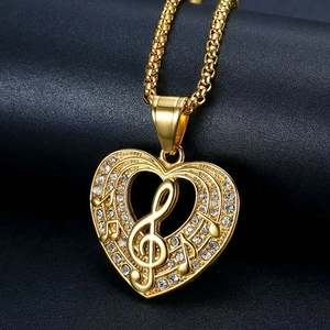 Gold plated hip hop heart necklace with treble clef and music notes on black leather