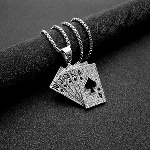 Detail of silver hip hop poker royal flush pendant with paved crystals on black stand
