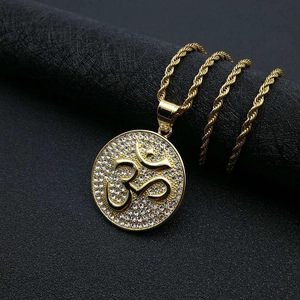 Gold-plated Om pendant necklace with sparkling rhinestones on a twisted chain