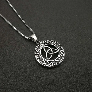 Detailed close-up of a silver stainless steel Celtic Trinity knot round pendant necklace