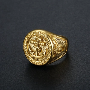 Men's gold plated titanium ring featuring embossed eagle and nautical anchor motifs