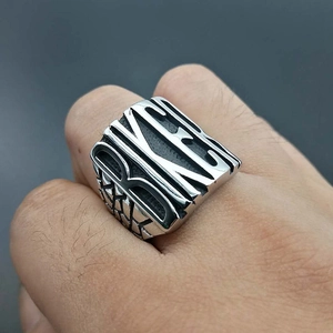 Men's punk biker ring in silver stainless steel featuring a hollowed KING letter design