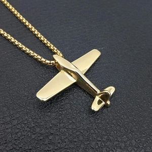 Polished gold plated titanium steel airplane pendant necklace on box chain