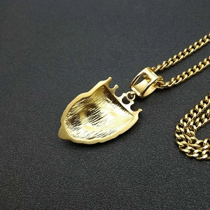 Detailed back view of a gold-plated crown lion head pendant with grainy brushed texture