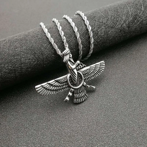 Silver Faravahar pendant necklace with detailed engravings on a vintage rope chain