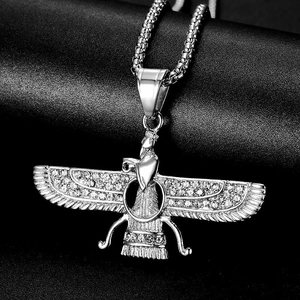 Silver Faravahar pendant necklace with rhinestone wings on black textured display