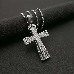 Iced-out hip hop cross pendant necklace in gold-plated steel with sparkling crystals