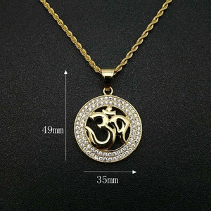 Detail view of gold Om pendant showing 49mm height and 35mm width dimensions