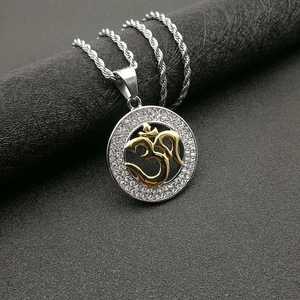 Gold plated stainless steel Om pendant necklace with white crystals on a twist chain