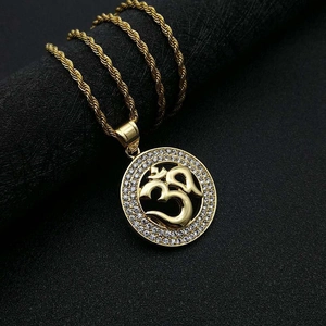 Gold plated stainless steel Om pendant necklace with iced out crystals and rope chain