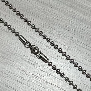 Detail of 3mm stainless steel ball chain with lobster clasp and secure tube connector