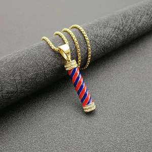 Gold plated barber pole pendant necklace with red white blue spiral and crystals