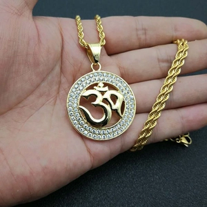 Golden titanium steel Om pendant necklace with sparkling zircon pavé and twist chain