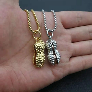 Hip hop style gold and silver peanut pendant necklaces with detailed texture on hands